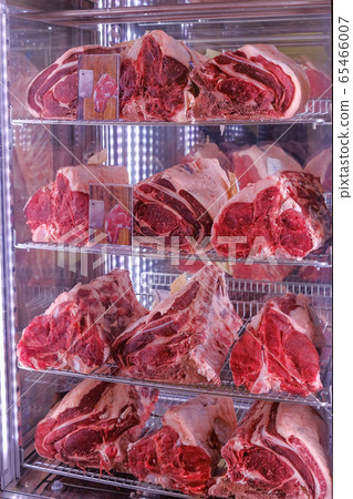 Raw dry aged Bistecca Alla Fiorentina, T-Bone or Porterhouse Steak at the entrance of a restaurant in Florence, Italy Raw dry aged Bistecca Alla Fiorentina, T-Bone or Porterhouse Steak at the entrance of a restaurant in Florence, Italy 65466007