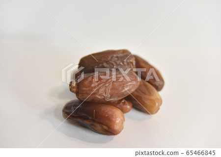 several dry dates on the white background several dry dates on the white background 65466845