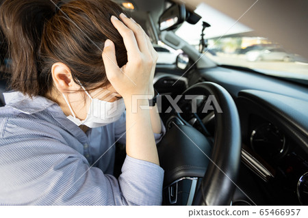 Stressed woman with protective medical mask,asian girl driving a car having headache,worried about illness,afraid of infection of Coronavirus,anxiety,pandemic of Covid-19,scared of contagious disease Stressed woman with protective medical mask,asian girl driving a car having headache,worried about illness,afraid of infection of Coronavirus,anxiety,pandemic of Covid-19,scared of contagious disease 65466957