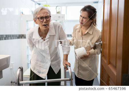 Asian senior woman hand holding her bottom suffer from hemorrhoids,anal fissure,anal pain,constipation in toilet,elderly having abdominal pain,diarrhea or food poisoning,symptom of colorectal cancer Asian senior woman hand holding her bottom suffer from hemorrhoids,anal fissure,anal pain,constipation in toilet,elderly having abdominal pain,diarrhea or food poisoning,symptom of colorectal cancer 65467396