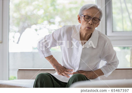 Sick senior patient with belly pain,severe stomach ache,symptoms gastrointestinal system disease,gut,digestion problems,diarrhoea,elderly woman suffer from stomachache,irritable bowel,food poisoning Sick senior patient with belly pain,severe stomach ache,symptoms gastrointestinal system disease,gut,digestion problems,diarrhoea,elderly woman suffer from stomachache,irritable bowel,food poisoning 65467397