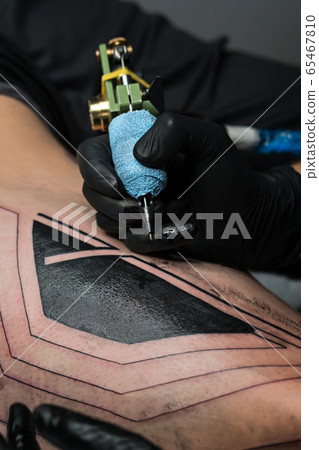 Process of making tattoo close up 65467810