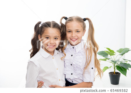 Back to school. Happy little girls in uniform. Back to school. Happy little girls in uniform. 65469382