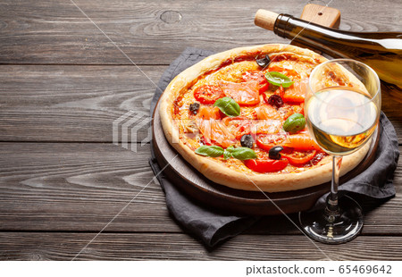 Tasty homemade seafood pizza with salmon Tasty homemade seafood pizza with salmon 65469642