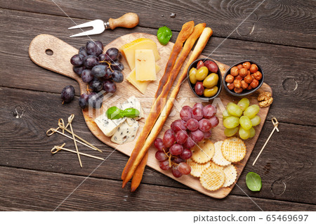 Cheese, meat, grapes and olives antipasto 65469697