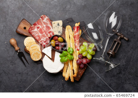 Cheese, meat, grapes and olives antipasto Cheese, meat, grapes and olives antipasto 65469724