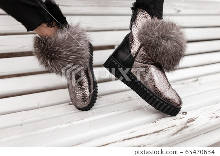 Close-up of female legs in boots 65470634