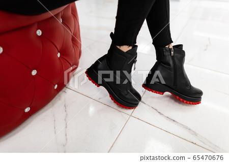 Closeup of female legs in trendy leather boots 65470676