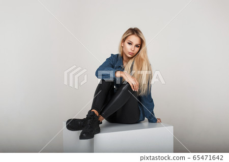 Young woman in fashion denim clothes Young woman in fashion denim clothes 65471642