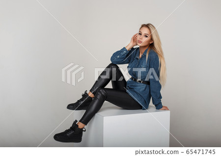 Young fashionable blond woman in fashion denim Young fashionable blond woman in fashion denim 65471745
