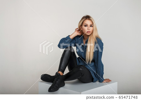 Beautiful young stylish woman in trendy denim wear Beautiful young stylish woman in trendy denim wear 65471748