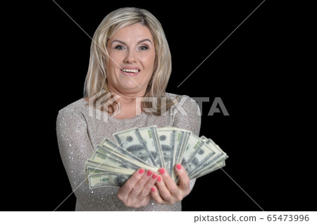 Portrait of happy elderly woman with dollars Portrait of happy elderly woman with dollars 65473996