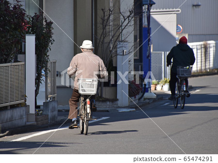 Senior riding a bicycle 65474291
