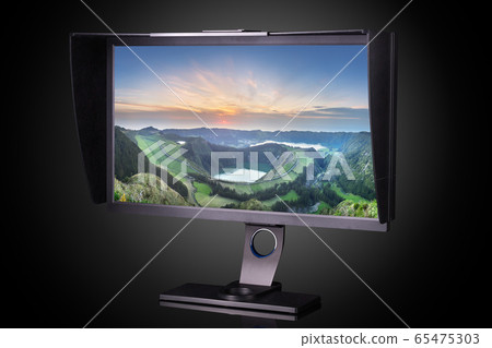 Professional photographer monitor with shading hood isolated on black 65475303