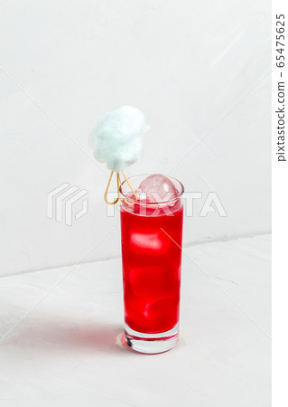 Sweet delicious red fruit cocktail in a highball 65475625