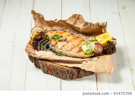 Appetizing delicious grilled salmon fillet lemon Appetizing delicious grilled salmon fillet lemon 65475708