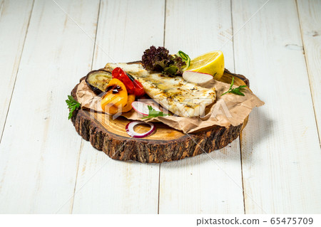 Appetizing delicious grilled fish with vegetables Appetizing delicious grilled fish with vegetables 65475709