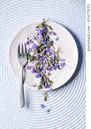 Edible flowers on plate Edible flowers on plate 65477653