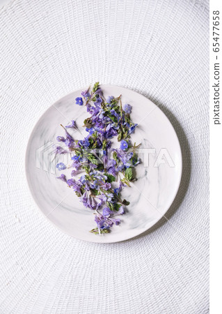 Edible flowers on plate Edible flowers on plate 65477658