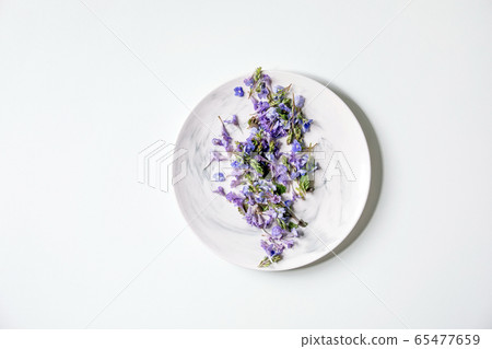 Edible flowers on plate Edible flowers on plate 65477659