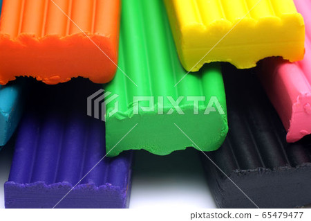 Orange, blue, green, yellow and black plastic clay Orange, blue, green, yellow and black plastic clay 65479477