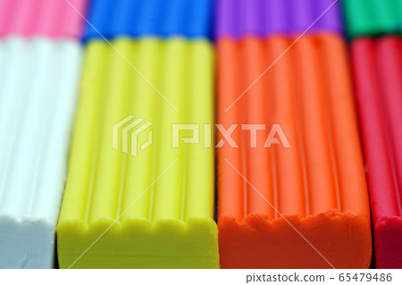Multi-colored set of plasticine sticks closeup 65479486