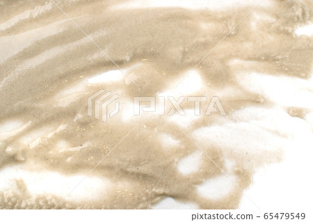 Sandy beach textured pile isolated on white 65479549