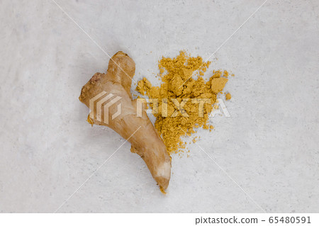 Ginger root and ginger powder flat lay in the 65480591