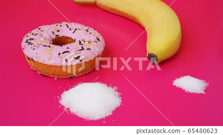 Choice donut against banana. Starting healthy eating or junk food Choice donut against banana. Starting healthy eating or junk food 65480623