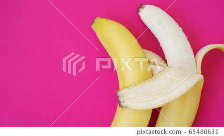 The concept of a friendly couple. Banana like a husband embraces another one The concept of a friendly couple. Banana like a husband embraces another one 65480631