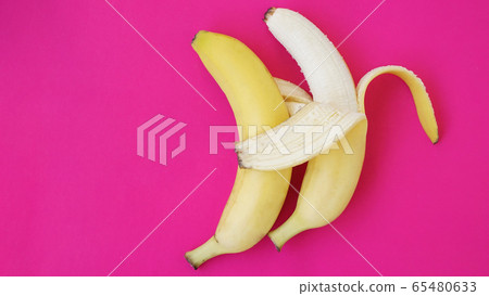 The concept of a friendly couple. Banana like a husband embraces another one The concept of a friendly couple. Banana like a husband embraces another one 65480633