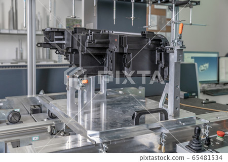 3D measuring device in a factory for the production of plastic castings for the automotive industry 3D measuring device in a factory for the production of plastic castings for the automotive industry 65481534