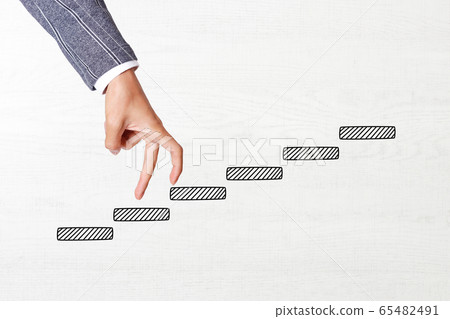 Businessman climbing stairs Businessman climbing stairs 65482491