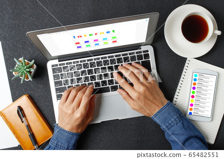 Man working on a computer 65482551