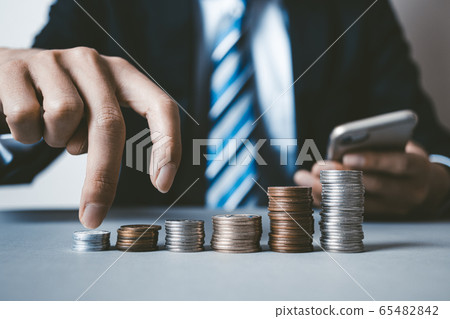 Business man dealing with smartphone Business man dealing with smartphone 65482842