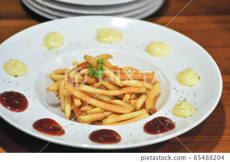 French fries dish or fried potato French fries dish or fried potato 65488204