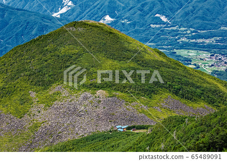 Kasayama and youth hut seen from Yatsugatake mountain range and Gongendake 65489091