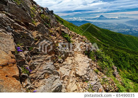 Mt. Fuji seen from the chain of the Yatsugatake mountain range and Gongendake ridge 65490035