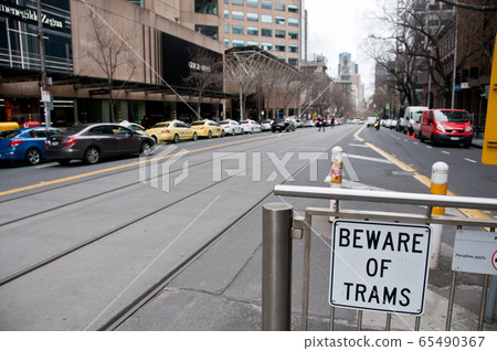 A sign to beware of the tram public transport station in Melbourne Victoria Australia 65490367