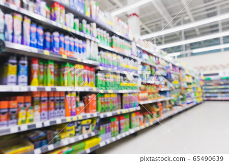 Blurred variety of insecticide spray cans on shelves at grocery store supermarket Blurred variety of insecticide spray cans on shelves at grocery store supermarket 65490639