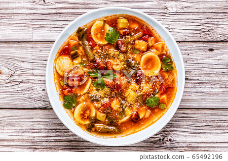 Minestrone, italian vegetable soup with pasta and 65492196