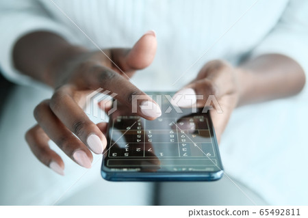 Black Woman Playing Sudoku On Phone For Brain Training Black Woman Playing Sudoku On Phone For Brain Training 65492811