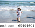 Girls playing in the sea 65494601