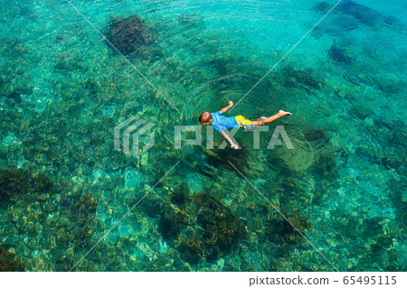 Kids snorkel. Children snorkeling in tropical sea. Kids snorkel. Children snorkeling in tropical sea. 65495115