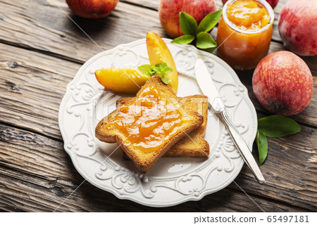 Healthy breakfast with toast and peach jam 65497181