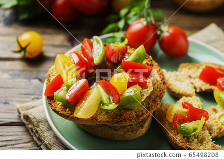 Traditional italian bread frisella with tomatos 65498208