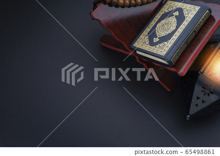 Holy Al Quran with written arabic calligraphy 65498861