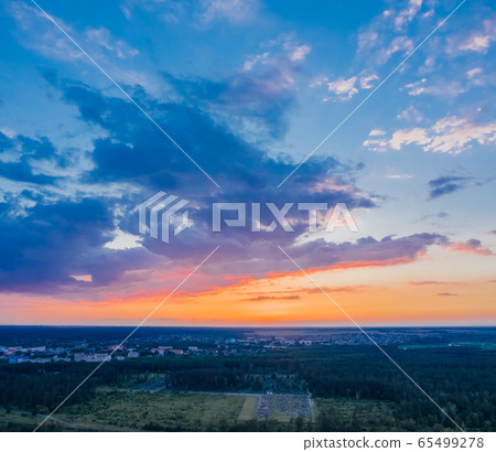 Picturesque evening sky with late afternoon clouds with reflection sunlight in the clouds Picturesque evening sky with late afternoon clouds with reflection sunlight in the clouds 65499278