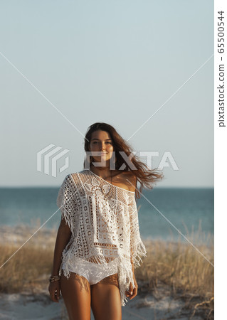 Woman Resting on the Beach During Vacation Woman Resting on the Beach During Vacation 65500544
