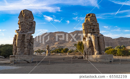 The Colossi of Memnon, two stone massive statues The Colossi of Memnon, two stone massive statues 65502239